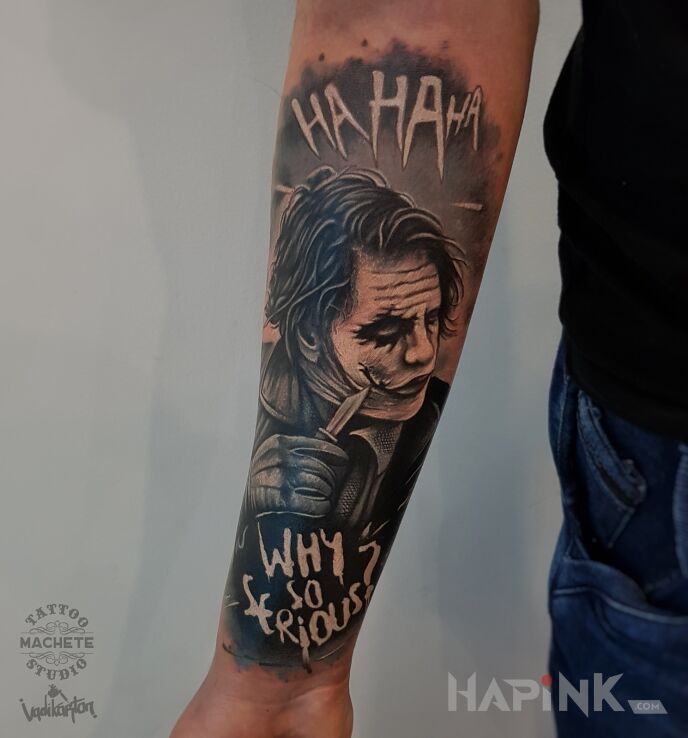 Tattoo Joker z nożem in characters motif and realistic style on the forearm