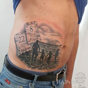 Tattoo Family by the sea on the stomach motif: black and gray style: realistic