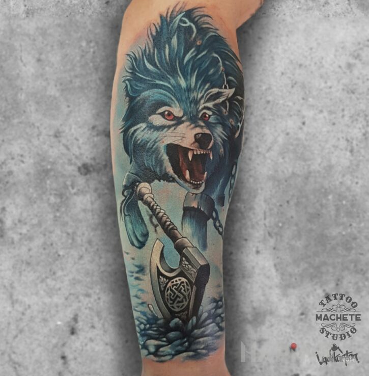 Tattoo Wilk w łańcuchach in animals motif and realistic style on the forearm