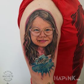 Tattoo Little girl with glasses On the arm motif: lettering style: Watercolor