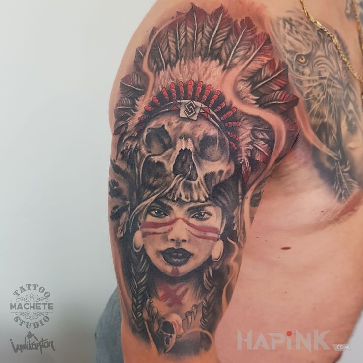 Tattoo Indianka z czaszką i piórami in black and gray motif and realistic style on the upper arm