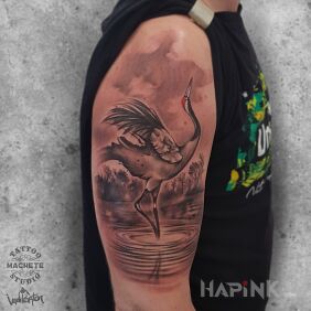 Tattoo A crane stands on one leg in the river On the arm motif: animals style: realistic