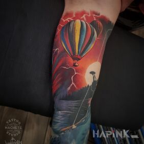 Tattoo Balloon flying towards the sun on the bicep motif: colorful style: realistic