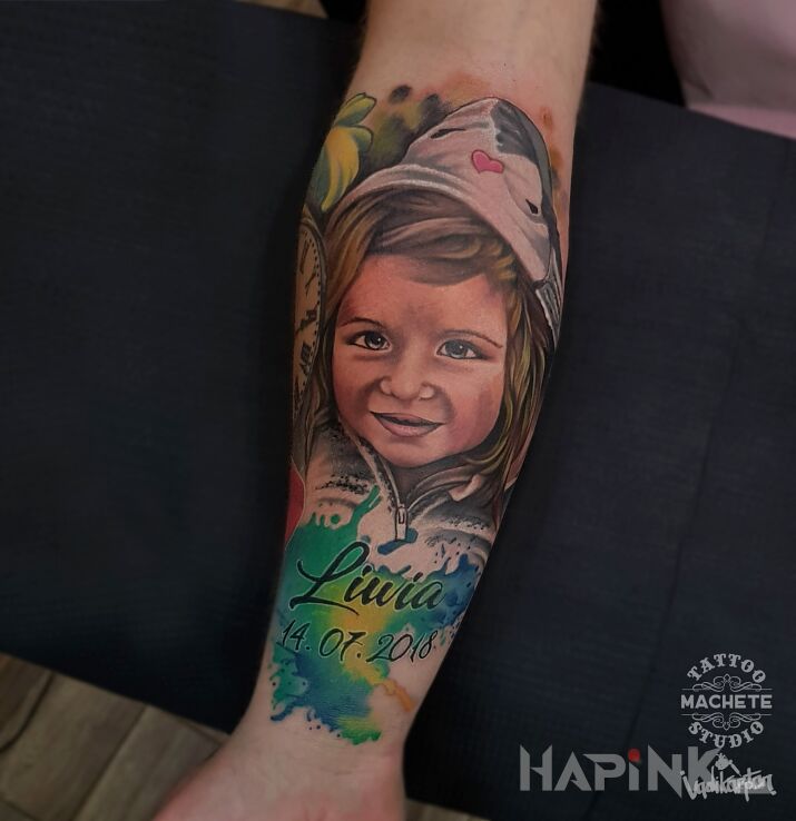 Tattoo Portret małej dziewczynki in faces motif and realistic style on the forearm