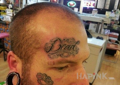 Tattoo Dead in lettering motif on the head