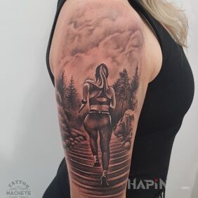 Tattoo Woman doing sports on the upper arm motif: 3D style: realistic