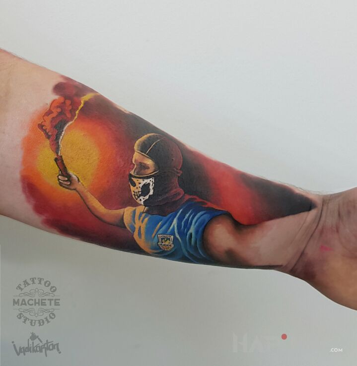 Tattoo Arka Gdynia in characters motif and realistic style on the forearm