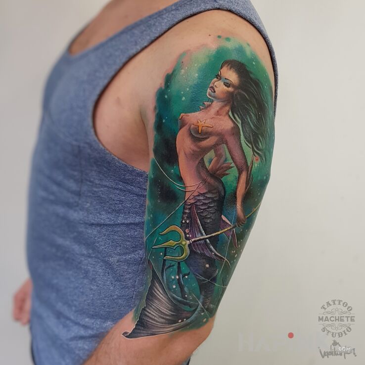 Tattoo Syrenka z trójzębem in characters motif and realistic style On the arm