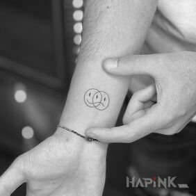 Tattoo Smiling and sad at the same time On the arm motif: other style: minimalistic
