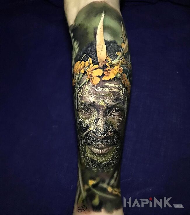 Tattoo Realistyczny portret buszmena in characters motif and realistic style on the forearm