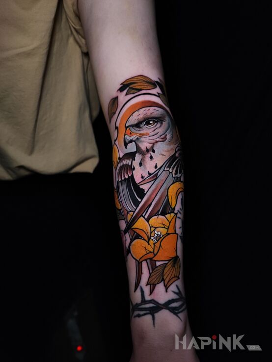 Tattoo Myszołów włochaty in flowers motif and neo-traditional style On the arm