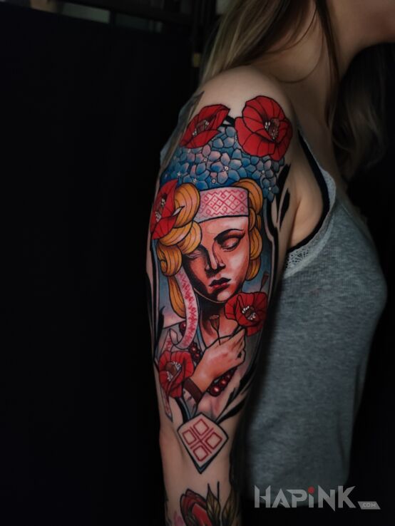 Tattoo Mokosz, Bogini Słowiańska in faces motif and neo-traditional style on the upper arm