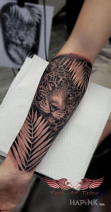 Tattoo Jaguar in black and gray motif and realistic style on the forearm