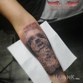Tattoo Puppy On the arm motif: animals style: realistic