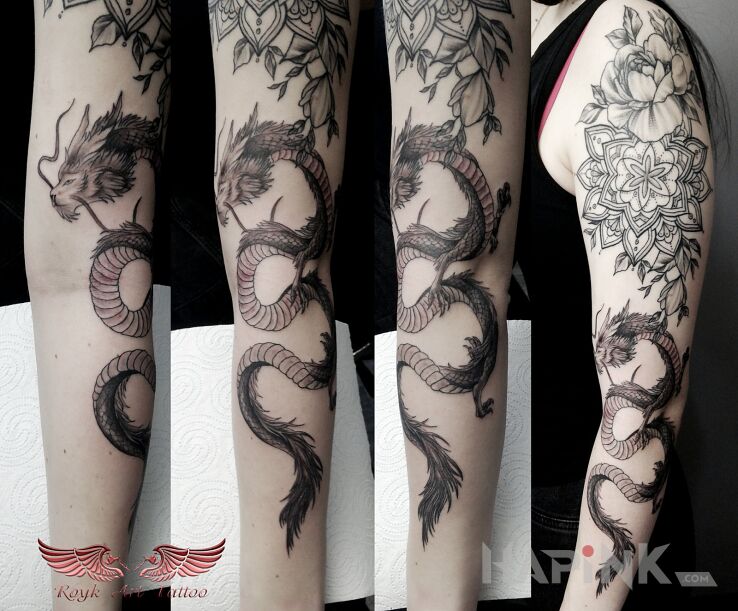 Tattoo Smok in black and gray motif and graphic / illustrative style on the forearm