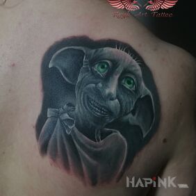 Tattoo Zgredek on the shoulder blades motif: fantasy style: realistic