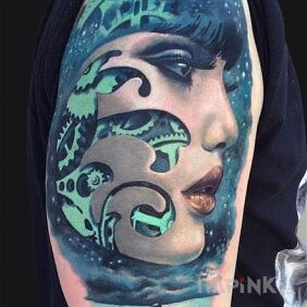Tattoo On the edge of the sea on the upper arm motif: 3D style: realistic