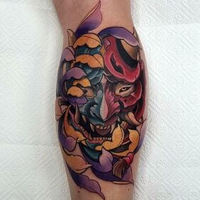 Tattoo Hanya mask on the leg motif: demons style: neo-traditional