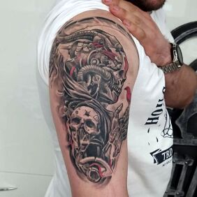 Tattoo Skull demon machine on the upper arm motif: dark style: realistic
