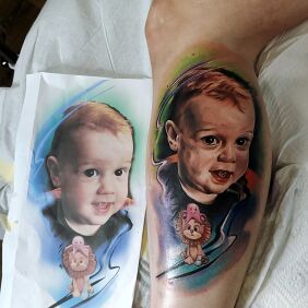 Tattoo Portrait of a son on the leg motif: colorful style: realistic