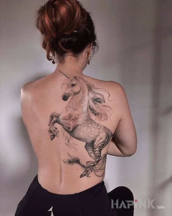 Tattoo Jednorożec na dwóch nogach in black and gray motif and realistic style on the shoulder blades