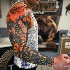 Tattoo Flowers not only for women On the arm motif: butterflies style: realistic