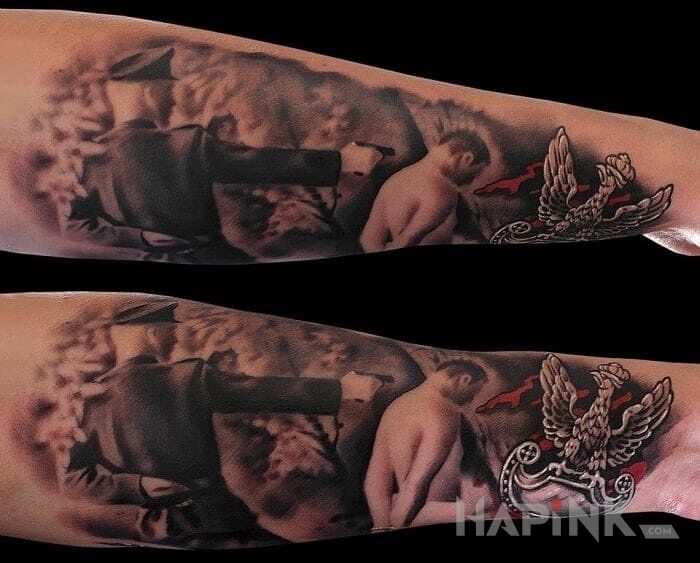 Tattoo Trzeba pamiętać in patriotic motif on the forearm