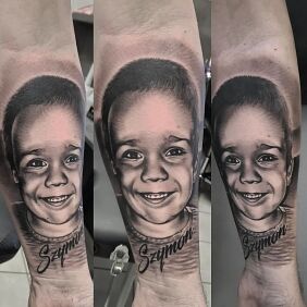 Tattoo Szymek's Portrait On the arm motif: black and gray style: realistic