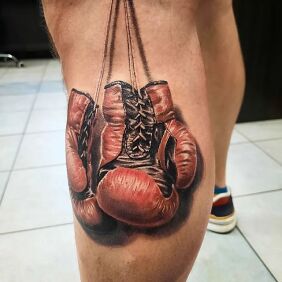 Tattoo Boxing gloves on the calf motif: colorful style: realistic
