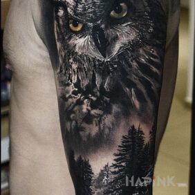 Tattoo Realistic owl on the upper arm motif: animals style: realistic