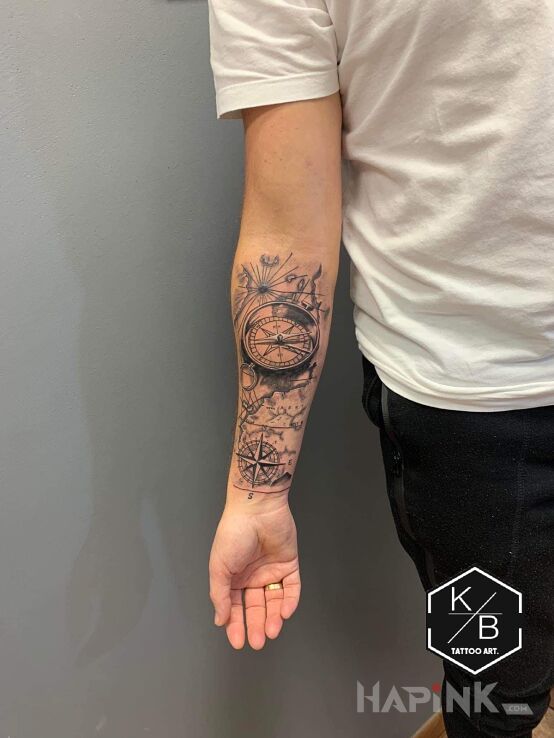 Tattoo Mapa in black and gray motif and realistic style on the forearm