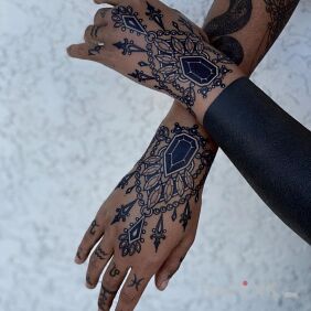 Tattoo Black sparkles On the arm motif: other style: blackwork / blackout