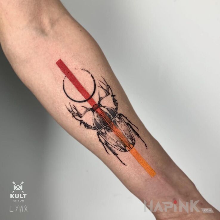Tattoo ŻUK in insects motif and graphic / illustrative style on the forearm