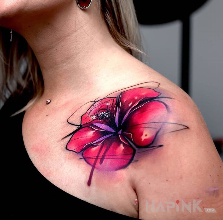 Tattoo Kwiat na barku in flowers motif on the upper arm