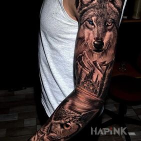 Tattoo Wolf with two-colored eyes On the arm motif: black and gray style: realistic