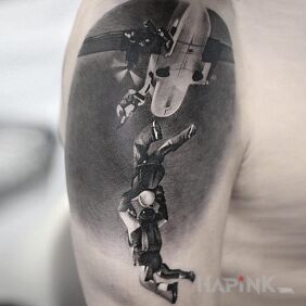 Tattoo In heaven on the upper arm motif: 3D style: realistic