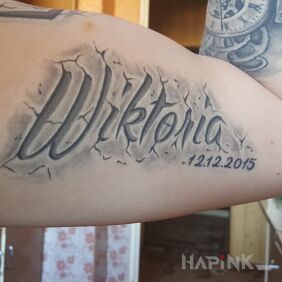 Tattoo Caption on the upper arm motif: lettering