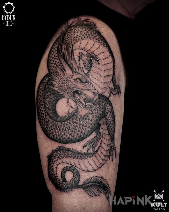 Tattoo DRAGON in black and gray motif and dotwork style On the arm