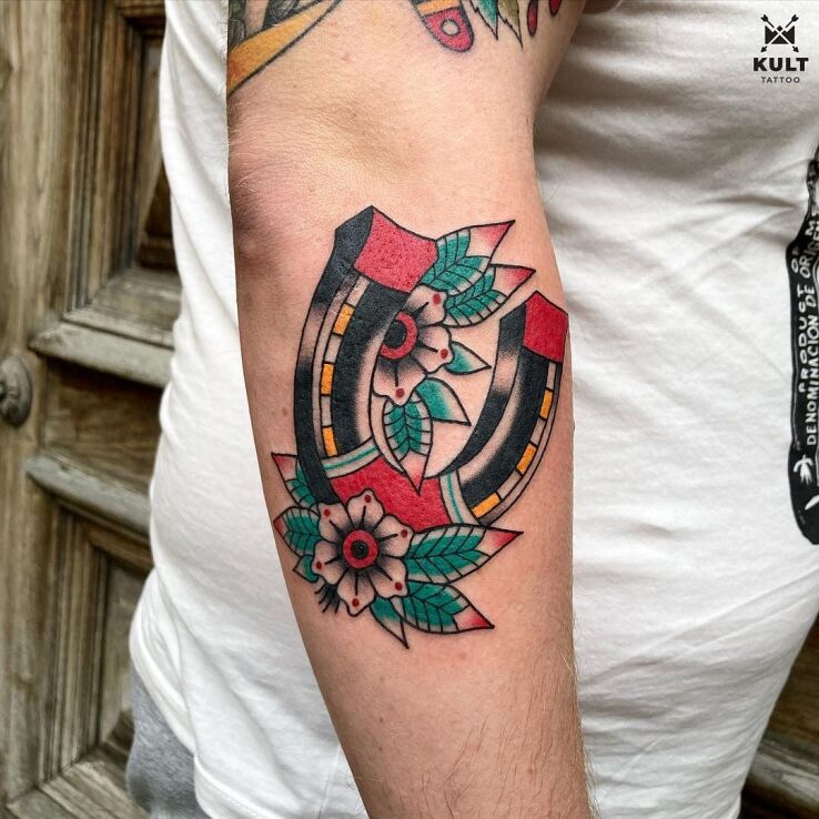 Tattoo HORSESHOE in objects motif and oldschool style on the forearm