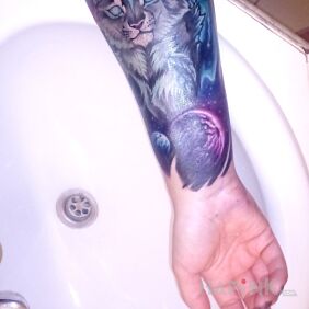 Tattoo Lynx and cosmos On the arm motif: cosmos style: graphic / illustrative
