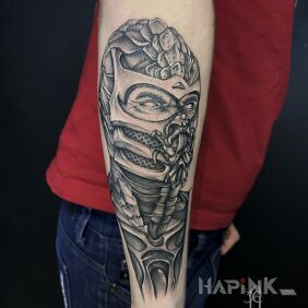 Tattoo Scorpion MK on the forearm motif: faces style: realistic
