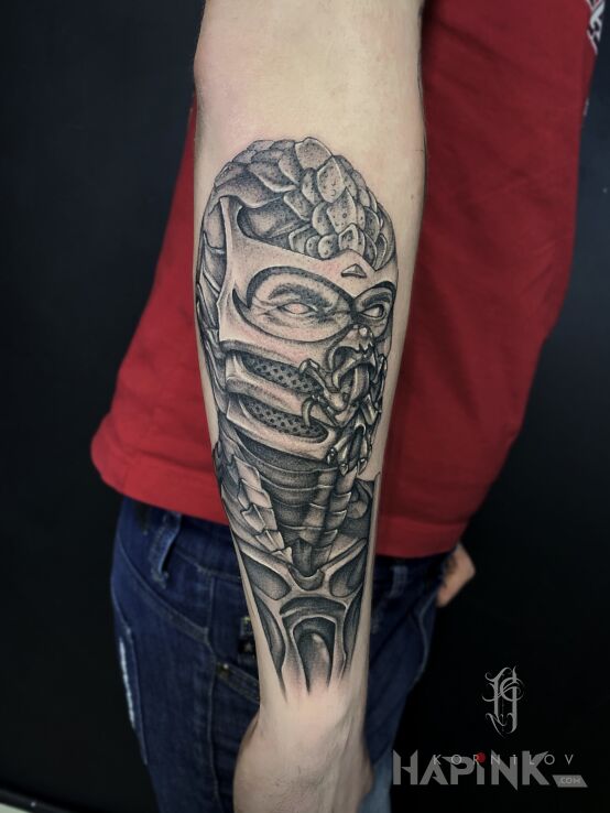 Tattoo Scorpion MK in demons motif and realistic style On the arm
