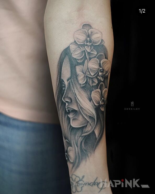 Tattoo Girl in black and gray motif and realistic style on the forearm