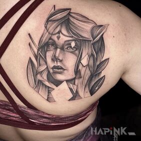 Tattoo Amazon on the shoulder blades motif: faces style: realistic