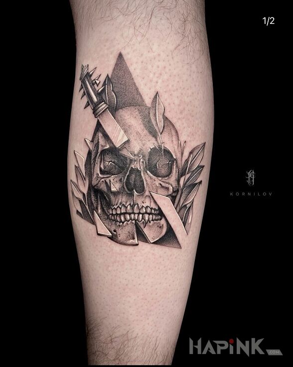 Tattoo Skull in skulls motif and realistic style on the leg
