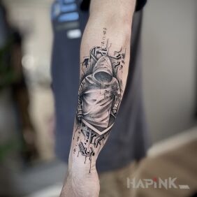 Tattoo A N O N Y M O U S On the arm motif: characters style: graphic / illustrative