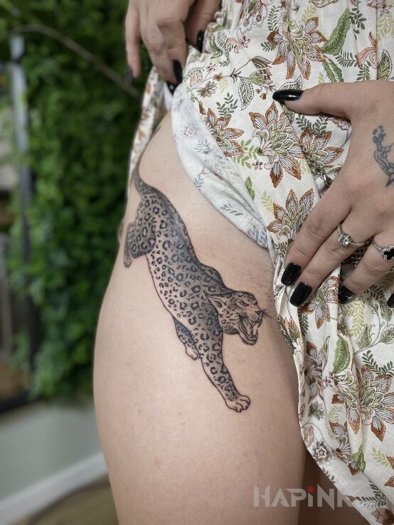 Tattoo L E O P A R D in animals motif and graphic / illustrative style on the hip