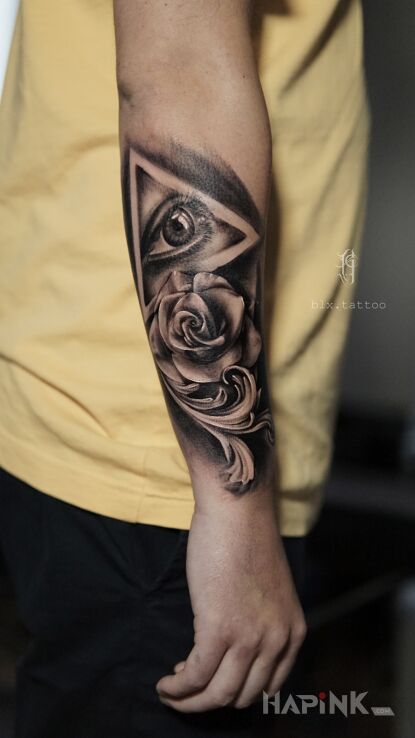 Tattoo Eye in black and gray motif and realistic style On the arm