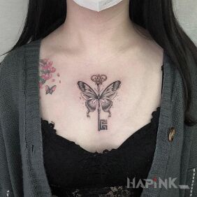 Tattoo Butterfly key on the chest motif: objects style: graphic / illustrative