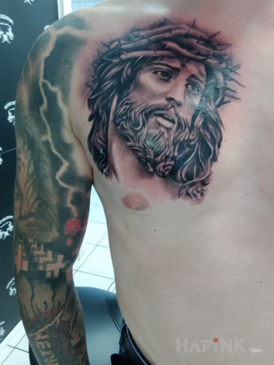 Tattoo Tattoo Jezus in black and gray motif and realistic style on the chest
